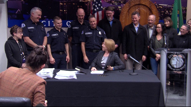 Mayor Durkan signs contracts for firefighters, represented employees