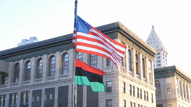 City leaders & community members raise Black Liberation Flag over Seattle City Hall